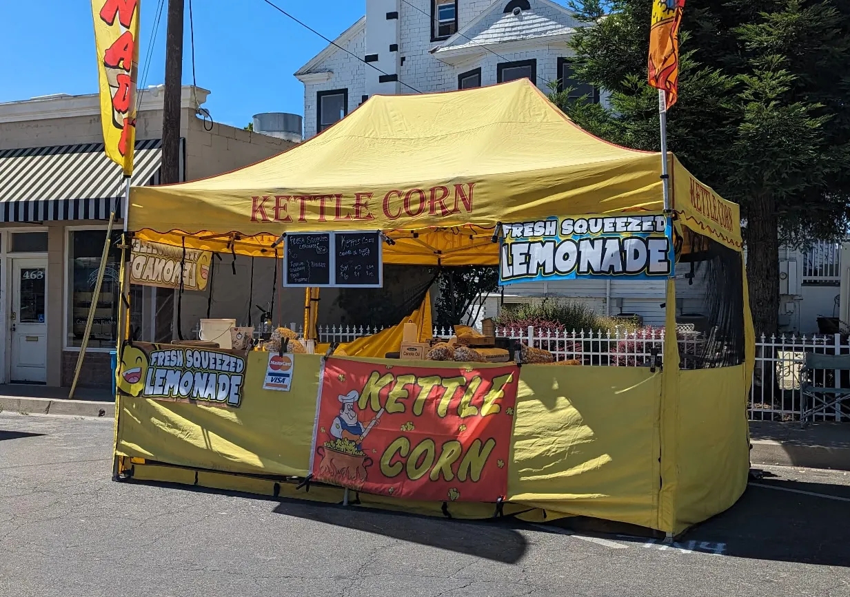 Yellow tent at a downtown street fair